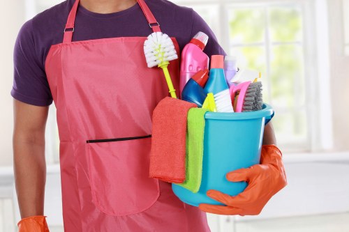 Mattress cleaning tools and fresh bedding in a bedroom
