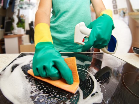 Detailed move in cleaning of kitchen cabinets and surfaces